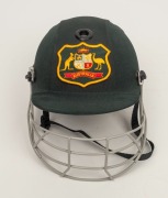 GLENN McGRATH'S AUSTRALIAN TEST TEAM BATTING HELMET, green, with the Australian coat-of-arms embroidered to the front panel; a "TEST 2000" type, made by Albion and dated 94-95 on their label to the right side of the protective grill; signed (and dedicated - 3