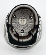 GLENN McGRATH'S AUSTRALIAN TEST TEAM BATTING HELMET, green, with the Australian coat-of-arms embroidered to the front panel; a "TEST 2000" type, made by Albion and dated 94-95 on their label to the right side of the protective grill; signed (and dedicated - 6