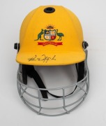 PAUL REIFFEL'S AUSTRALIAN TEAM ONE-DAY CRICKET HELMET: yellow fabric over the protective helmet, with the Australian coat-of-arms embroidered to the front panel; made by Albion with their "97-98" dated label at right on the protective grill. In very good - 2