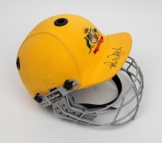 PAUL REIFFEL'S AUSTRALIAN TEAM ONE-DAY CRICKET HELMET: yellow fabric over the protective helmet, with the Australian coat-of-arms embroidered to the front panel; made by Albion with their "97-98" dated label at right on the protective grill. In very good - 3