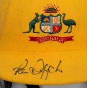 PAUL REIFFEL'S AUSTRALIAN TEAM ONE-DAY CRICKET HELMET: yellow fabric over the protective helmet, with the Australian coat-of-arms embroidered to the front panel; made by Albion with their "97-98" dated label at right on the protective grill. In very good - 5
