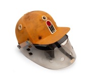 KERRY PACKER'S WORLD SERIES CRICKET 1977 - 1979: An original W.S.C. Australian team batting helmet with protective visor, the W.S.C. logo stitched to the front of the helmet; in match-worn condition. Extremely scarce.