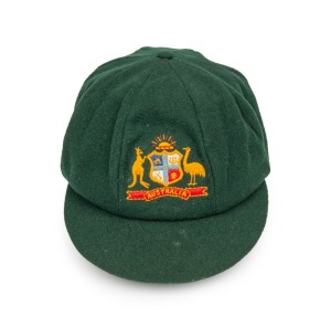 GRAEME WOOD'S AUSTRALIAN TEST TEAM BAGGY GREEN from the 1985 Ashes Tour of England, with the Australian coat-of-arms embroidered to the front panel; made by Albion, with their original label which also bears Wood's original signature in ink. Fine condition. Provenance: Charles Leski Auctions, 19th August 2008. Graeme Wood appeared for Australia in 59 Test Matches between 1978 and 1988.