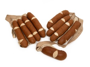 An antique pair of brown leather and canvas padded open-palm cricket batting gloves, c1900; often referred to as "cigar" gloves. Rare survivors. (2).