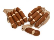 An antique pair of brown leather and canvas padded&nbsp;open-palm cricket batting gloves, c1900; often referred to as "cigar" gloves. Rare survivors. (2).