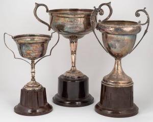 SOUTH MELBOURNE - SWANS: Two impressive silver-plated trophies awarded to Reginald Francis "Rex" Ritchie (1914 – 2006) in 1935 - the 2nd Eighteen "Best & Fairest" trophy, and the "Capitol Bakeries Cup"; together with a Regent Cricket Club Batting Average Cup, also won by Ritchie in 1937-38. (3 items); the tallest 37cm (incl. bakelite stand).