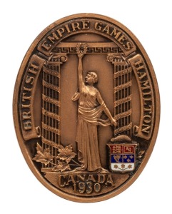 1930 1st BRITISH EMPIRE GAMES IN HAMILTON, Participation Medal "British Empire Games Hamilton/Canada/1930", bronze and enamel, oval shaped, 39 x 50mm. Very attractive and scarce. The medal offered together with "Canadian Amateur Rowing Association Certificate of Competitive Achievement" presented to H. Fry. (2 items)