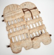 A pair of late-nineteenth century match-used "skeleton" open-ribbed cane and leather cricket pads, with leather straps and buckles. (2). Each approx. 67cm. - 2