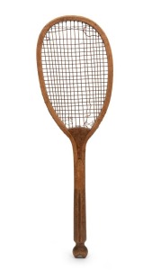 An antique fish-tail tennis racquet&nbsp;with an Ash timber frame, lop-sided&nbsp;head and a convex Mahogany-shaped wedge screwed into position. Original gut strings and with gilt "E. O. & Co." retailer's name to one side; circa 1900. Length: 69cm.