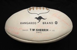 A T.W.Sherrin Kangaroo Brand white ball signed by SOUTH MELBOURNE - SWANS players, including Fred Goldsmith, Ron Clegg, Peter Bedford, Bob Pratt, Laurie Nash, Graham Teasdale, Hughie McLaughlin Snr., etc.