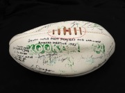 A Kookaburra white football, titled 'SOUTH MELB. PAST PLAYERS and OFFICIALS ANNUAL MEETING 1985' with signatures including Kevin Doolan, Jim Kennelly, Jeff McGee, Jack Lugg, Peter Tippett, Ian Tampion, Alan Miller, Tom Crane and many others.