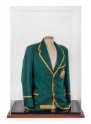 THE 1954-55 AUSTRALIAN TEST TEAM CRICKET BLAZER WORN BY LEN MADDOCKS, during the Test Series against the West Indies, green wool with gold piping, the Australian coat-of-arms, and the date "1954-55" embroidered in silk to the jacket pocket; attractively p