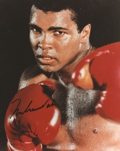 A collection of autographs including Muhammad Ali signed photo; Ali & Leon Spinks signed piece; Leon Spinks (3 signed b&w photos); Rubin Hurricane Carter autograph on October 1993 piece; and an unused ticket to the Albany Armory (New York) to watch the Ali v Bugner fight on June 30, 1975. (Total: 7 items).