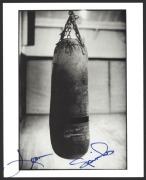 A collection of autographs including Muhammad Ali signed photo; Ali & Leon Spinks signed piece; Leon Spinks (3 signed b&w photos); Rubin Hurricane Carter autograph on October 1993 piece; and an unused ticket to the Albany Armory (New York) to watch the Al - 3