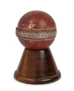 ARTHUR MORRIS: Mounted presentation cricket ball with a sterling silver ring engraved "PRESENTED BY NEW SOUTH WALES Cricket Associated To A. R. MORRIS in Recognition of His World's Record Performance, a Century in Each Innings (146 and 111) of His 1st Class Match, N.S.W. v. Queensland, Sydney, December, 1940." 12cm high overall.