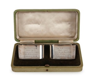 1948 AUSTRALIAN TOUR TO ENGLAND: A cased pair of silver napkin rings presented by Don Bradman to Arthur Morris, both engraved "TO ARTHUR FROM YOUR ADMIRING SKIPPER DON BRADMAN, ENGLAND 1948". Accompanied by a letter of authenticity signed by Arthur Morris. The case 16cm wide. (2 items).