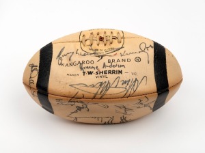 COLLINGWOOD FOOTBALL CLUB: Black and white Sherrin football signed by members of the team, circa mid to late 1970s.