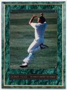DENNIS LILLEE and SHANE WARNE: Two signed mounted colour photograph displays, the larger 38 x 27cm overall. - 2