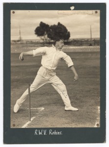WALTER ROBINS (1906-68): Two action photographs featuring Robins, the English bowler who played in 19 Tests; one showing his bowling stance (signed by Robins) 24 x 18cm; and, another showing Robins after bowling, and getting past Rigg, with Fingleton (who has signed) at the other end; 26.5 x 25.5cm. (2 images, both signed and mounted).