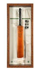 "SIR DON BRADMAN - THE MASTER'S BLADE": An attractive display which incorporates a reproduction Sykes test world record Don Bradman full size cricket bat with a card bearing the original signature of Don Bradman, together with details of his career and some photographs. Assembled by the Bradman Museum and Legends Memorabilia with a CofA identifying this as number 26/52. All attractively presented in a custom built display case, 115 x 51cm overall.