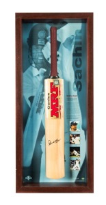"STROKES OF GENIUS - SACHIN TENDULKAR": A display featuring a full size Genuis MRF cricket bat signed by Tendulkar, together with details of his career and photographs. Accompanied by a PWC CofA, this being number 26/100. Attractively framed glazed, 107 x 51cm overall.