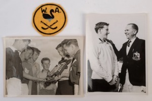 GRAHAM MCKENZIE COLLECTION - 1956 W.A. SCHOOLBOYS HOCKEY CAPTAIN: press photographs (22x16.5cm) showing McKenzie with other State Captains during the 1956 Under 16 Hockey Championships held at Brisbane, the other showing McKenzie, being congratulated by his father Eric (WA manager/coach) after Western Australia became U-16 Champions of Australia by winning the 1957 Australian Schoolboys Hockey Carnival held at Launceston; also circular 'W.A.' patch for hockey shirt