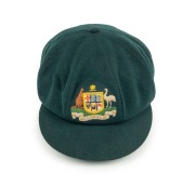 CLARRIE GRIMMETT'S AUSTRALIAN&nbsp;"BAGGY GREEN" PRESENTATION&nbsp;TEST CAP: Green wool, with embroidered coat-of-arms that differs that differs from the usual design. This cap bears the official Australian coat-of-arms as set out in the 1912 Royal Warrant. It show