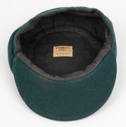 THE 1948 AUSTRALIAN TEST TEAM BAGGY GREEN CAP WORN BY SID BARNES: Green wool with embroidered Coat of Arms and 1948 to the front panel; Farmer's, Sydney label to the internal peak with "S. G. Barnes" added in manuscript. Overall in very good condition wit - 7