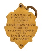 THE 1965 BROWNLOW MEDAL, 9ct gold, blue enamel; engraved verso "VICTORIAN FOOTBALL LEAGUE - CHAS BROWNLOW TROPHY - SEASON 1965 WON BY IAN HARLOW STEWART" - 2