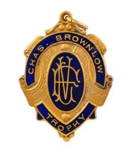 The 1971 Brownlow Medal, 9ct Gold, Blue Enamel; Engraved Verso "Victorian Football League - Chas Brownlow Trophy - Season 1971 - Won By Ian Harlow Stewart"