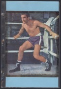 An album containing a collection of signed photographs, cards, postcards and cuttings, with the signatories including Archie Moore, Dado Marino, Sam Ichinose, Freddie Mills, Doug Miller, Rinty Monaghan, Andries Steyn, Manuel Ortiz, Danny O'Sullivan, Jim P - 2