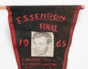 "ESSENDON FINAL 1965" supporters' pennant depicting Ken Frazer. 46cm. Essendon defeated St.Kilda in the Grand Final.&nbsp;The match, attended by 104,846 spectators, was won by Essendon by a margin of 35 points, marking that club's 12th premiership victory.&nbsp;The - 2