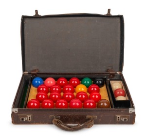 WALTER LINDRUM: Personal set of snooker and billiard balls in original boxes, housed in a leather travel case with Lindrum's shipping details affixed. The case 48cm wide.