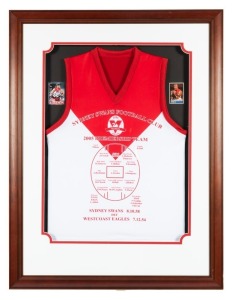 SYDNEY SWANS 2005 Premiership souvenir display featuring a specially printed Premiership Team jersey framed together with signed Paul Roos and Barry Hall collector cards; with a C of A verso. Framed & glazed. Overall 109 x 84cm