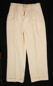 A pair of Clarrie Grimmett's pure wool cricket flannel trousers, circa 1930; with "GRIPU" label to rear waistband. This may have been a spare pair as they show no signs of wear or tear.