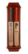 "County Autograph" full sized cricket bat signed by Don Bradman presented in a timber and perspex case alongside an "Australian Captains" bat signed by 19 captains (most autographs faded). 105cm high, 32.5cm wide, 17.5cm deep.