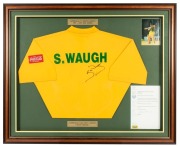 STEVE WAUGH'S 1997 AUSTRALIA v. SOUTH AFRICA ONE DAY SERIES SHIRT: Signed on the back beneath his printed name. Mounted, framed and glazed together with a letter of authenticity. Overall 90 x 110cm.