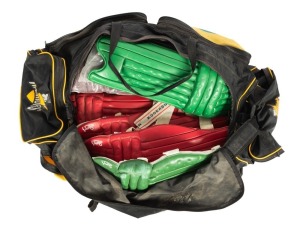 A Western Warriors kit bag containing eight used full-size cricket pads.