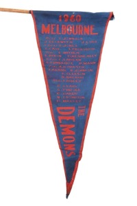 1960 MELBOURNE blue & red supporters pennant on original stick, showing the whole team in their positions. Overall 40cm.