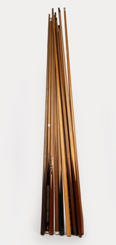 Fourteen assorted billiard cues from WALTER LINDRUM'S personal billiard room in Albert Park, Melbourne. Mixed vintages and manufacturers.