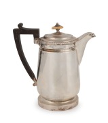 A Georgian sterling silver hot water pot with ivory finial and ebonized timber handle, made by Robert Garrard I of&nbsp;London, circa 1813, 21cm high, 702 grams total including handle and finial