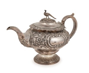 An antique Scottish sterling silver teapot with repousse floral decoration and pheasant finial, made in Edinburgh, circa 1834, 18cm high, 27cm wide, 766 grams