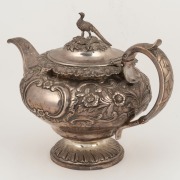 An antique Scottish sterling silver teapot with&nbsp;repousse floral decoration and pheasant finial, made in Edinburgh, circa 1834, 18cm high, 27cm wide, 766 grams - 3