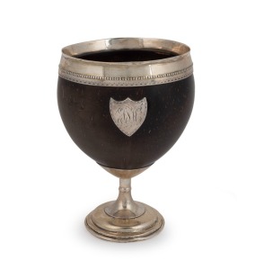 A Georgian silver mounted coconut goblet with applied silver shield with monogram, early 19th century, 13cm high