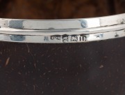 An antique sterling silver mounted coconut cup resting on pad feet, circa 1800, 9cm high - 3