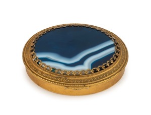 An antique French oval ormolu snuff box with hard stone top, 19th century, 8cm wide