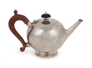 A vintage sterling silver bullet teapot by Wakely & Wheeler of London, circa 1931, 13cm high, 20cm wide, 372 grams including handle and finial.