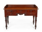 An antique Colonial Australian cedar desk with five drawers, turner legs, and gallery back, circa 1865, 79cm high, 117cm wide, 54cm deep