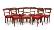 A set of nine Australian cedar spade back dining chairs comprising eight standards and one carver chair, each handsomely decorated with kangaroos and wildflowers, 20th century,