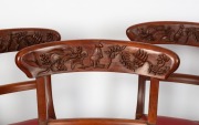 A set of nine Australian cedar spade back dining chairs comprising eight standards and one carver chair, each handsomely decorated with kangaroos and wildflowers, 20th century, - 2